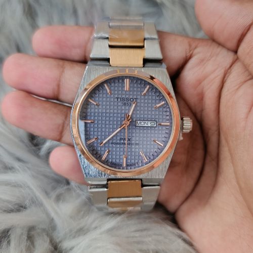 Case close-up of Tissot PRX 1853 Steel Chain Watch with polished finish