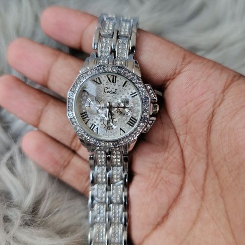 Close-up of Roman numeral dial with diamond-styled accents on women’s luxury watch
