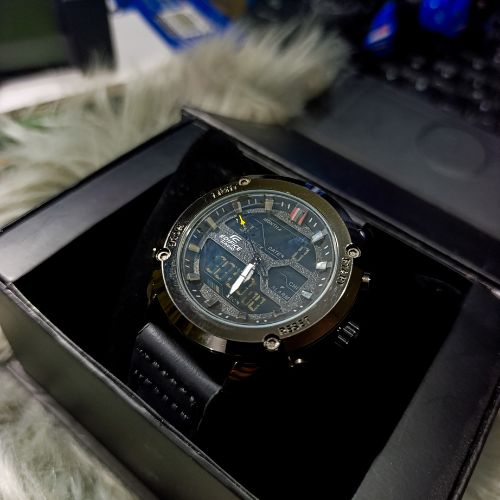 Close-up view of Casio Edifice black watch dial showing analog and digital time
