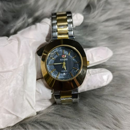 Timeless Rado DiaStar men’s watch with black dial, quartz accuracy, and polished gold stainless steel bracelet.