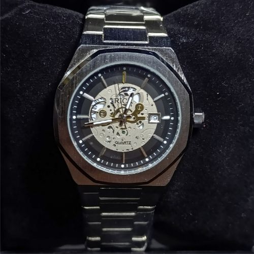 Side profile of brushed octagonal stainless steel watch case