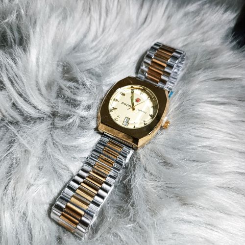 Side profile view of Rodd Classic Gold Dial Watch with gold & silver bracelet