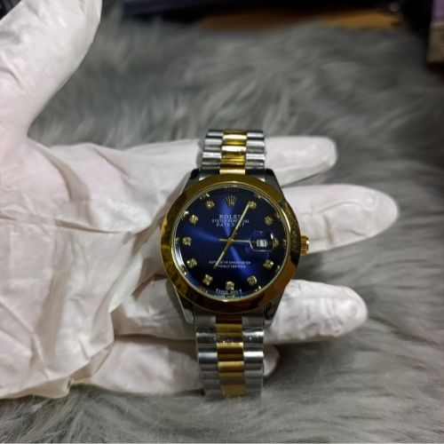 Side view of Rolex Oyster Perpetual watch case and crown