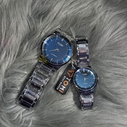 Elegant TOMI couple watch set with stainless steel bracelet and striking blue dial, designed as matching his & hers pair.