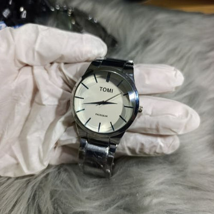 Premium TOMI wristwatch set for couples, including men’s and women’s sizes, with durable silver straps and sleek dial.