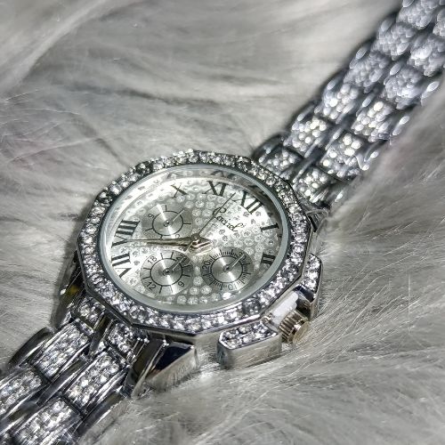Women’s stainless steel watch with diamond-styled accents and Roman numeral dial – side view