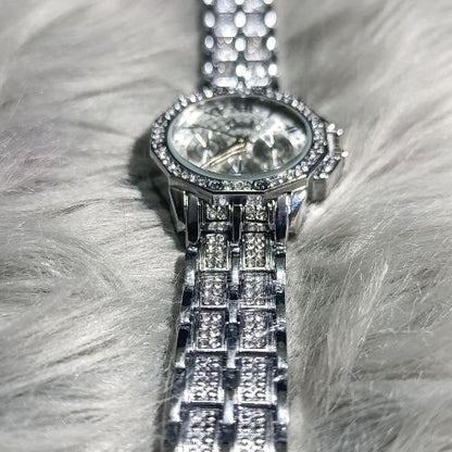 Durable stainless steel strap with diamond-styled detailing on elegant women’s watch